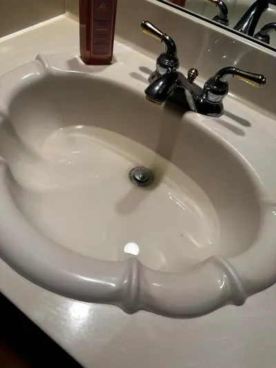 Stopped up bathroom sink during a drain cleaning call.