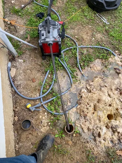 Auger cleanout sewer blockage during a drain cleaning call.