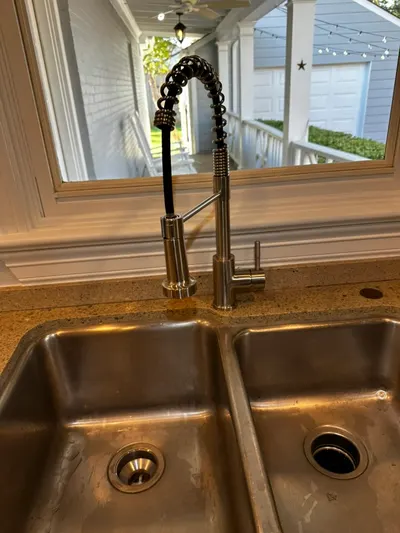 Install new kitchen faucet during a fixture installation.
