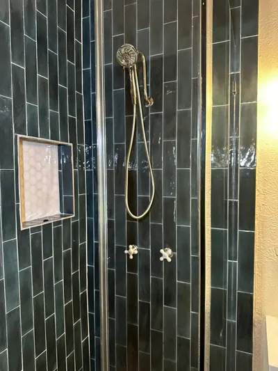 Install new shower head and replaced tile during a fixture installation.