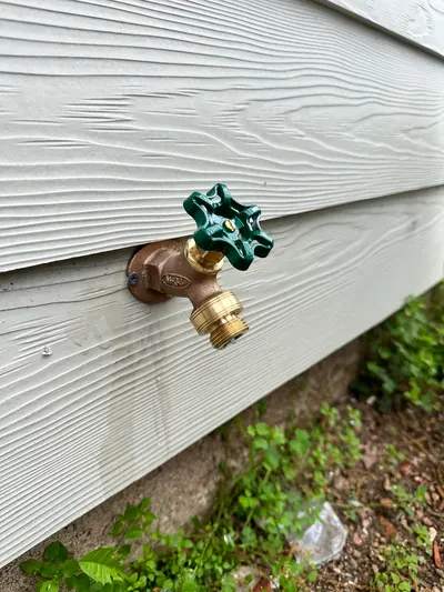 New outdoor faucet during a fixture installation.