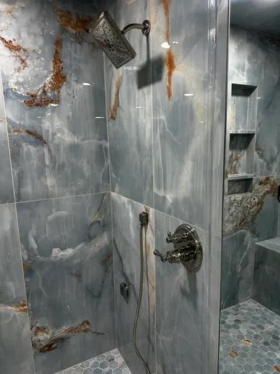 Rusted shower head needs replacing during a fixture installation.