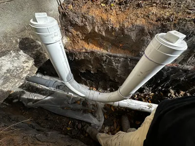 Install new cleanouts during sewer line work.