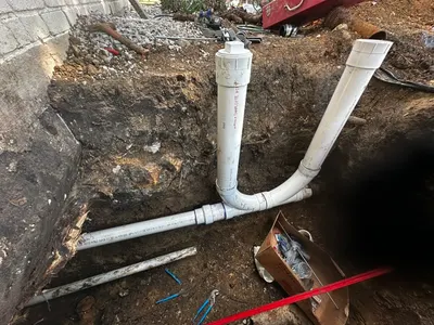 Install new cleanouts outside home during sewer line work.