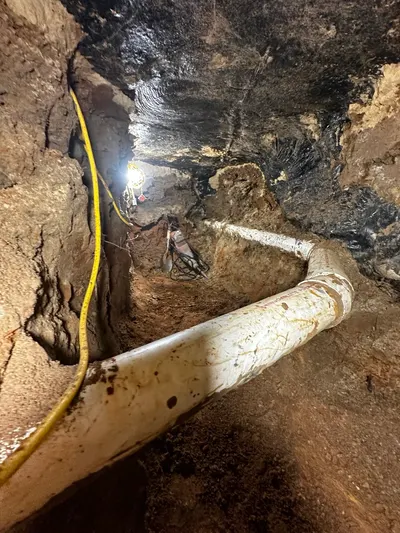 Expose broken pipe under slab during a slab leak repair.