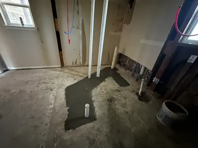 New concrete after repiping through slab during a slab leak repair.
