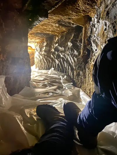 Tunnel under slab during a tunneling job beneath a Dallas-area home.