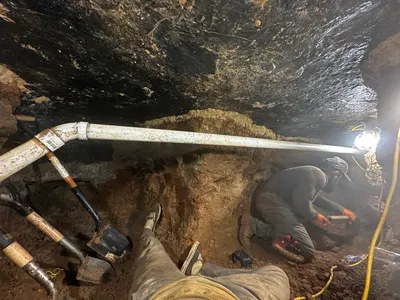 Tunneling under slab during a tunneling job beneath a Dallas-area home.