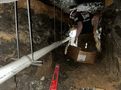 Under slab tunnel repair sewer during a tunneling job beneath a Dallas-area home.