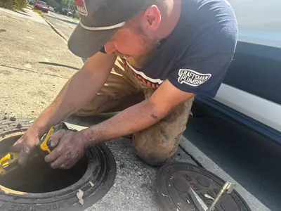 Arthur fix water meter connection during a water line repair.