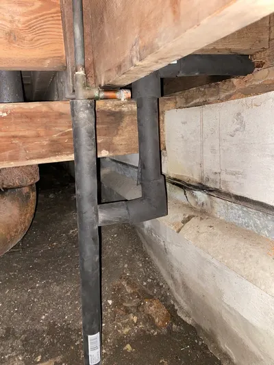 Under floor insulated pipe to outside during a whole-house repipe.